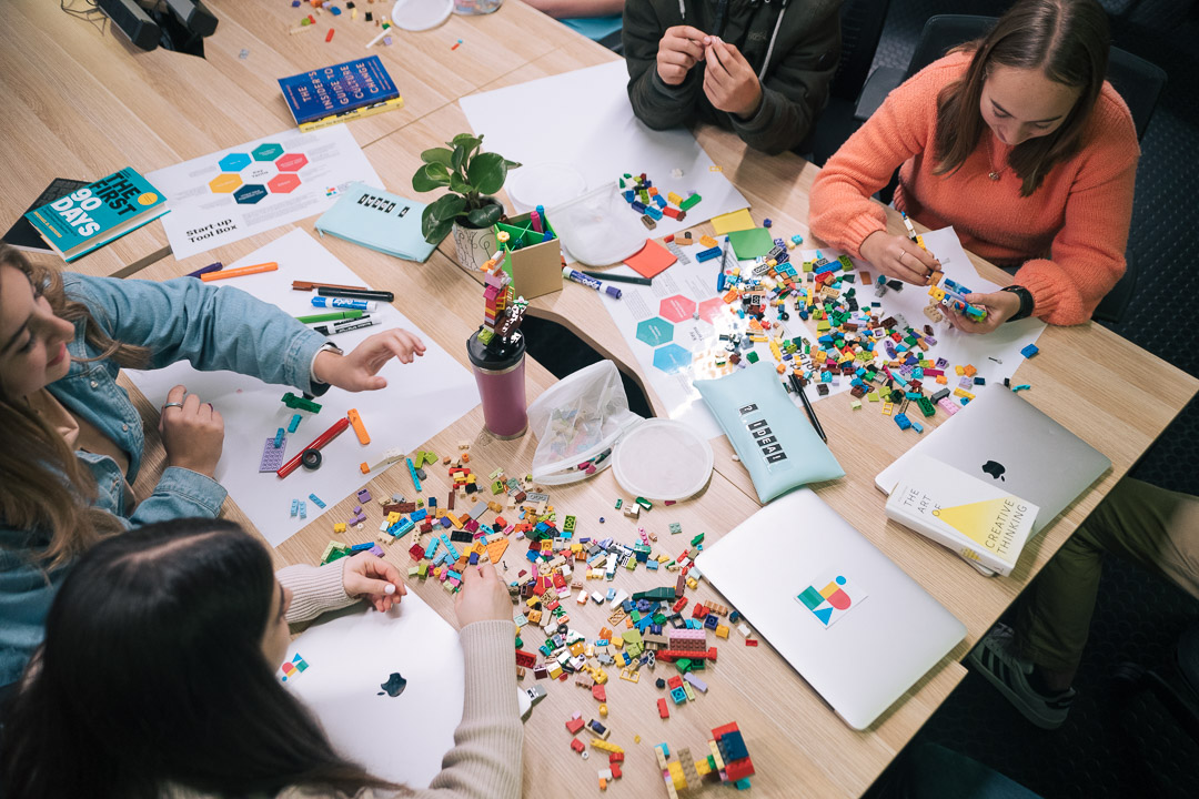 Teen students taking part in hands-on learning activities at IDEA Academy